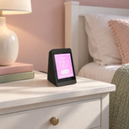 SugarHalo Mini with a pink display theme on a nightstand in a girl's bedroom.